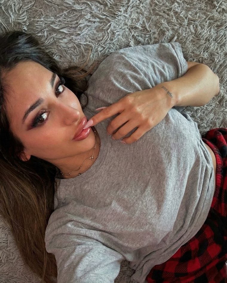Lena lying on a soft rug at home
